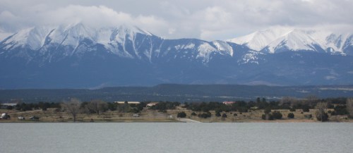 A view of the Spanish Peaks, two Colorado volcanic mountains,  beyond Lathrop State Park's Martin Lake. The peaks were a popular landmark for Santa Fe Trail travelers. -- Photo by Pat Bean 