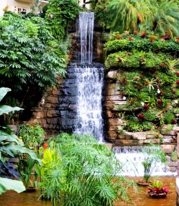One of numerous waterfalls that help create the illusion of bringing the outdoors inside. -- Photo by Pat Bean