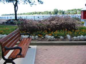 Just find me a bench, like this one that sits in Amherstburg, Ontario, beside an Erie River harbor and a book, and I can be happy for hours. -- Photo by Pat Bean 