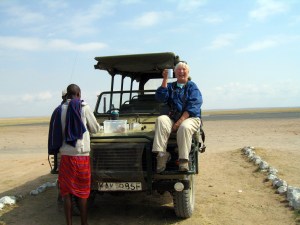 My itchy feet took me to Africa, where I pretended I was John Wayne in Hatari at the Amboseli National Park Airport in Kenya. -- Photo by Kim Perrin
