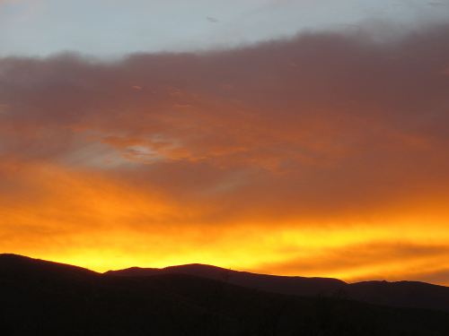 We watched what looked like was going to be a dud of a sunset. Even when the sun slipped below the horizon, the sky barely glowed yellow. And then suddenly, as if someone finally remembered to turn on the painted gels, the sunset sky exceeded even our expectations. -- Photo by Pat Bean 