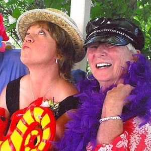 And this is me and my longtime good friend, Kim, who is as different from me as a hummingbird is from an eagle. The photo was taken at a photo booth that was part of her son's wedding reception. I love it, too. 
