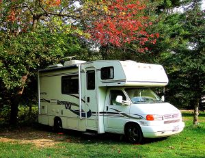 The red leaves of this tree at the Paul Bunyan Campground in Bangor Maine, that hung over Gypsy Lee were redder every morning during the week I stayed there. -- Photo by Pat Bean 